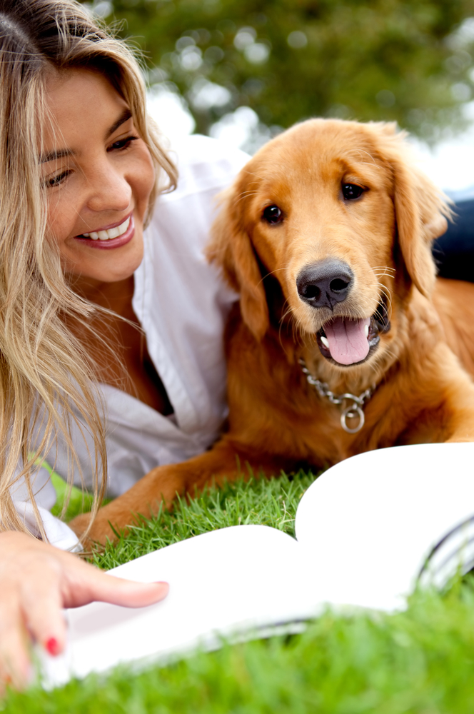 Beautiful woman enjoying with her dog outdoors